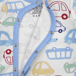 Baby outfit with blue buttons and car pattern